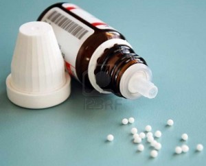 5981533-close-up-of-homeopathic-globule-pills-with-bottle